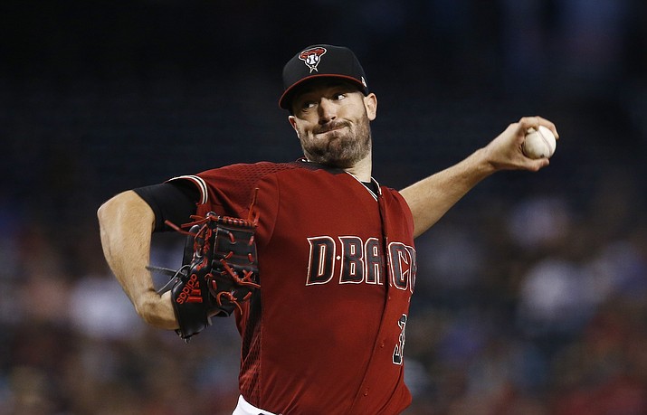 Arizona’s Robbie Ray throws a pitch against the Milwaukee Brewers during the first inning of a baseball game Sunday, June 11,  in Phoenix. (Ross D. Franklin/AP)