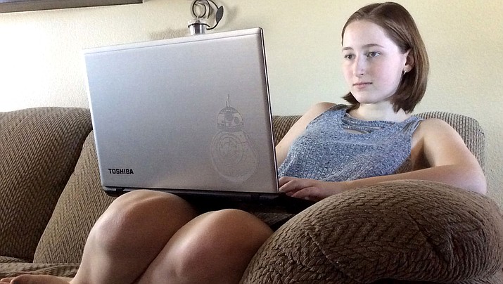 Sarina Senger, 15, working on her next novel. 
