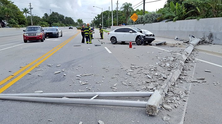 A serious crash occurred in the Florida suburbs Tuesday after the driver saw a spider loose in the car. (Broward Sheriff’s Office photo)