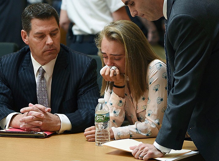 Michelle Carter cries while flanked by defense attorneys Joseph Cataldo, left, and Cory Madera, after being found guilty of involuntary manslaughter in the suicide of Conrad Roy III, Friday in Bristol Juvenile Court in Taunton, Mass. (Glenn C.Silva/Fairhaven Neighborhood News, Pool)