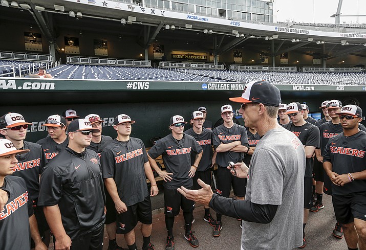 Oregon State coach Pat Casey addresses his players in the dugout before team practice in Omaha, Neb., Friday, June 16, 2017. Oregon State is on the cusp of joining the company of the greatest college baseball teams of all time. At 54-4, the Beavers enter the College World Series with the fewest losses of any team since 1982. (Nati Harnik/AP)