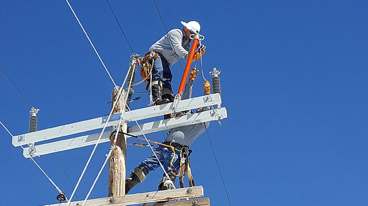 APS linemen fix a power line. (Courtesy)
