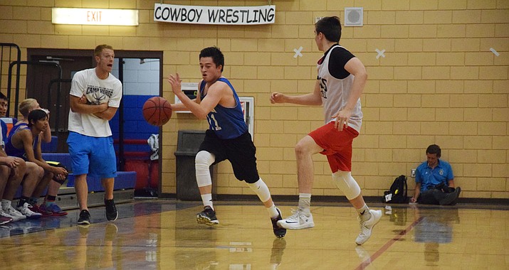 Camp Verde junior guard Ishmael Hogan takes the ball up the court on Friday night against Mingus Union at home. Cowboys’ head coach Daniel Wall said Hogan has been a pleasant surprise this spring and summer. (VVN/James Kelley)