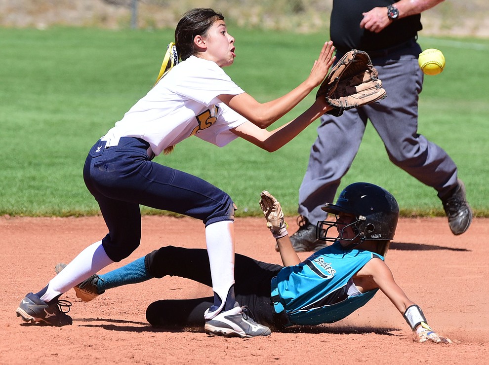 Aleah Murillo slides safely into second base as the Arizona Sand Snakes take on the Tucson Sun Cats in the first round of the Beat the Heat Softball Tournament at Heritage Park in Prescott Saturday, June 17. (Les Stukenberg/Courier)
