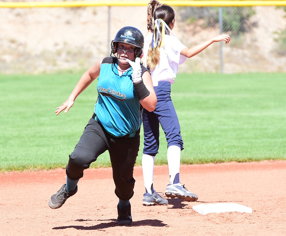 Tessa Martinez rounds second base as the Arizona Sand Snakes take on the Tucson Sun Cats in the first round of the Beat the Heat Softball Tournament at Heritage Park in Prescott Saturday, June 17. (Les Stukenberg/Courier)
