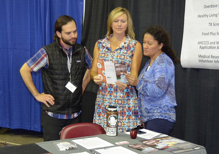Leslie Horton, center, confers with staff members concerning health materials for an educational presentation. (Courtesy photos/Yavapai County Health Services)