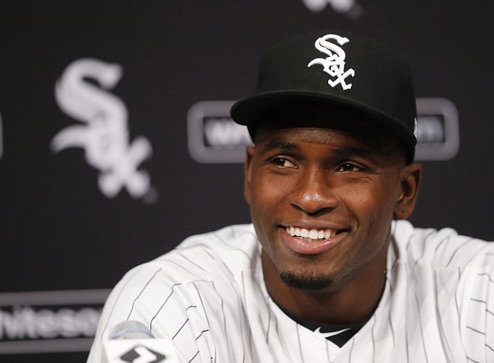 Cuban outfielder Luis Robert smiles at a news conferences after signing with the Chicago White Sox in Chicago. A record $203 million was spent on international amateur free agents in the just-ended signing period, nearly $50 million more than the previous high. (Charles Rex Arbogast/AP file)