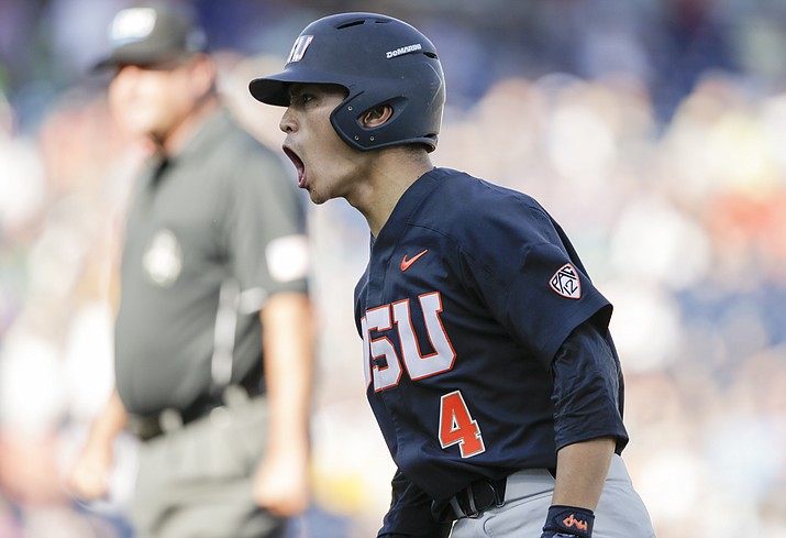 Oregon State’s Steven Kwan (4) reacts after reaching first base on a bunt in the first inning of an NCAA College World Series baseball game against LSU in Omaha, Neb., Monday, June 19. (Nati Harnik/AP)