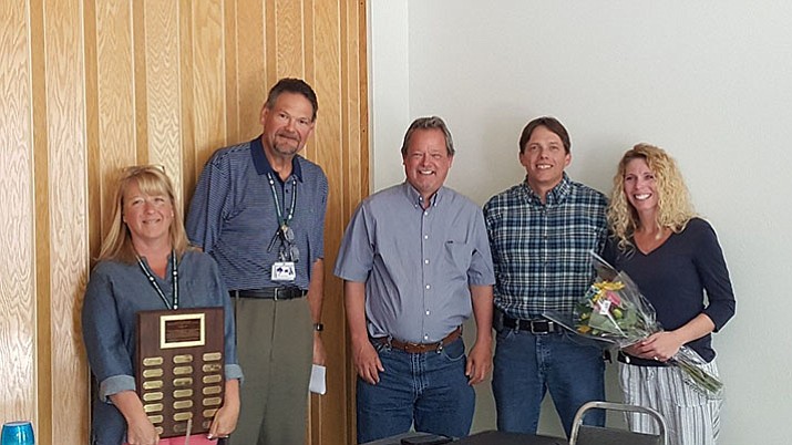 From left to right,  West Yavapai Guidance Clinic leaders sharing the news - Shawn Hatch, CCO; Larry Green, CEO; Kent Mattern, Deputy CCO; Sean Derry, Director of Children and Family Services; with honoree Kara Schumann, Child and Family Therapist. 