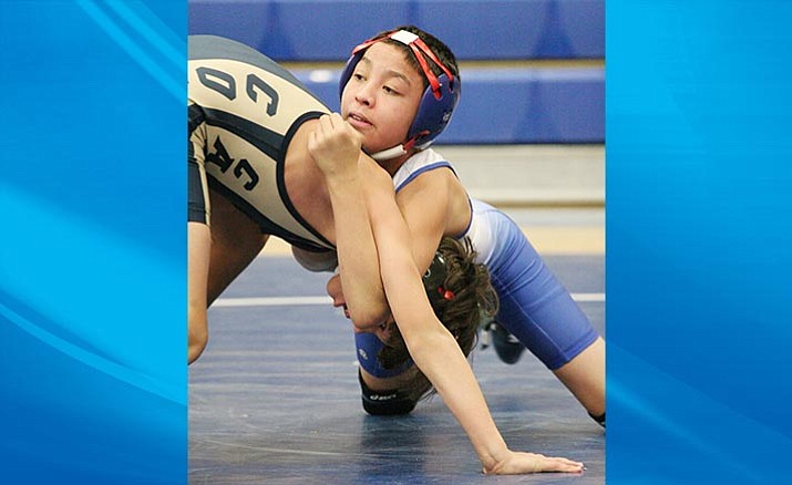 Keene Todacheene wrestles last year for Camp Verde against Casteel. Todacheene went undefeated last week at the Aztec Duals in New Mexico, winning outstanding wrestler. (Photo by Bill Helm)