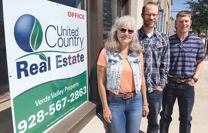 In the real estate business since 2004, Justin Chambers has opened United Country Real Estate in Camp Verde. Chambers, center, is pictured with his mother, realtor Jaynell Chambers, and realtor Matt Peterson. (Photo by Bill Helm) 

