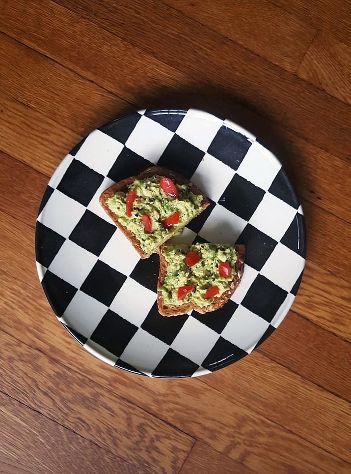 This June 10, 2017 photo shows a smash of seasoned avocado on toast in Larchmont, N.Y., and is one of the most popular toast toppings. It's also a big draw on Instagram, where the hashtag has nearly 400,000 posts. (Kim Cook via AP)