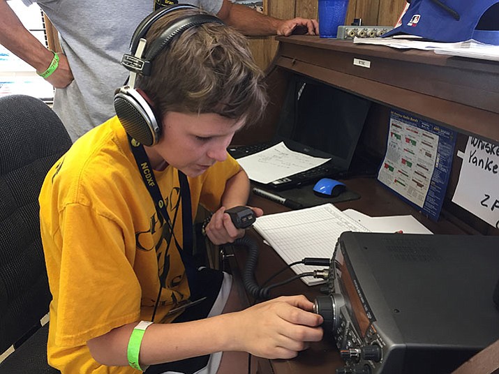 Jackson Fuller, an amateur radio technician, operates a radio during Yavapai Amateur Radio Club’s annual Amateur Radio Field Day. (Max Efrein/Courier)