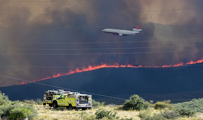 Fire crews both ground and aerial do their best on the Goodwin Fire as it approaches the town of Mayer Tuesday, June 27. (Les Stukenberg/Courier)