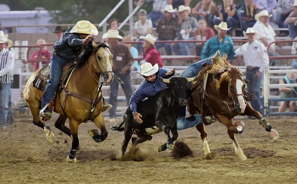 Sterling Lambert had a 6.3 second run in the steer wrestling during the opening performance of the Prescott Frontier Days Rodeo Wednesday, June 28 at the Prescott Rodeo Grounds.  (Les Stukenberg/Courier)