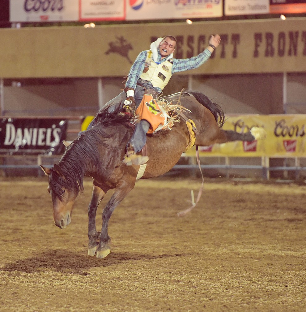 Tyler Waltz rides Frisky Chicken for a score of 79 in the bareback during the opening performance of the Prescott Frontier Days Rodeo Wednesday, June 28 at the Prescott Rodeo Grounds.  (Les Stukenberg/Courier)