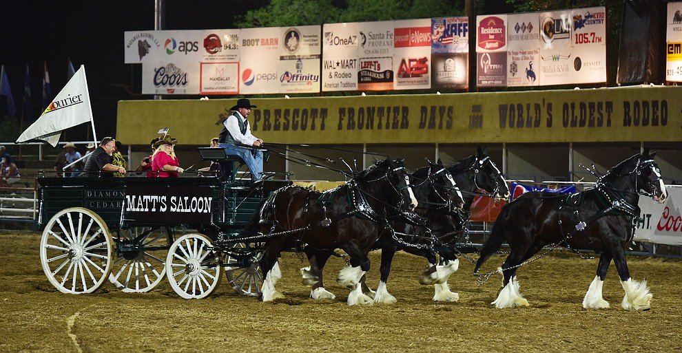 The Diamond Z English Shire Horses show their stuff in the arena during the opening performance of the Prescott Frontier Days Rodeo Wednesday, June 28 at the Prescott Rodeo Grounds.  (Les Stukenberg/Courier)
