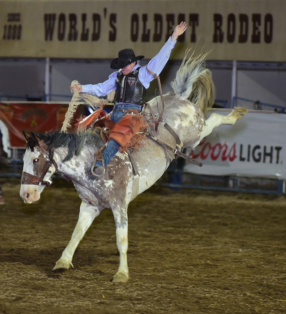 Brody Kress rides Apple Juice for a score of 77 in the saddle bronc during the opening performance of the Prescott Frontier Days Rodeo Wednesday, June 28 at the Prescott Rodeo Grounds.  (Les Stukenberg/Courier)