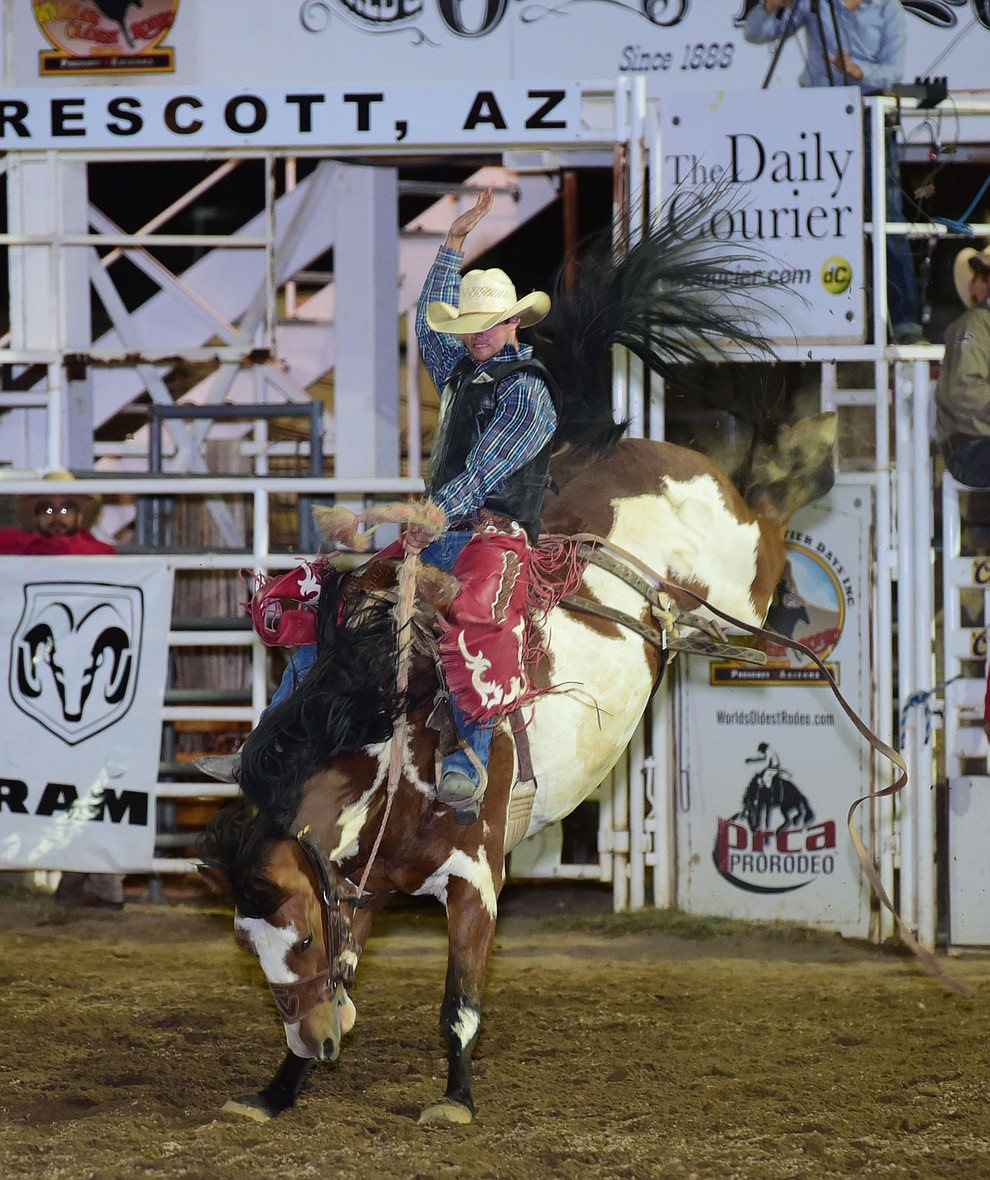 Toby Collins rides Painted Bear for a 78 in the saddle bronc during the opening performance of the Prescott Frontier Days Rodeo Wednesday, June 28 at the Prescott Rodeo Grounds.  (Les Stukenberg/Courier)