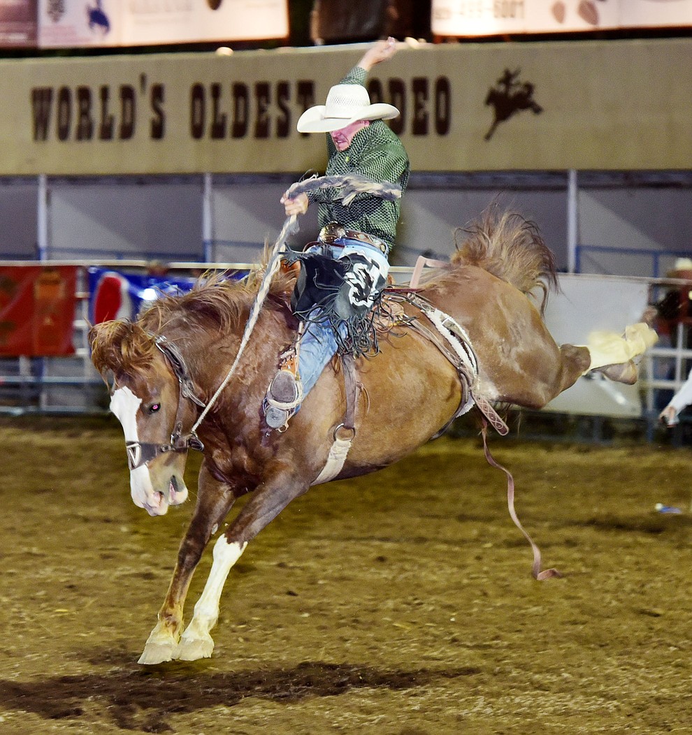 Kaden Deal rides Sombrero in the saddle bronc during the opening performance of the Prescott Frontier Days Rodeo Wednesday, June 28 at the Prescott Rodeo Grounds.  (Les Stukenberg/Courier)