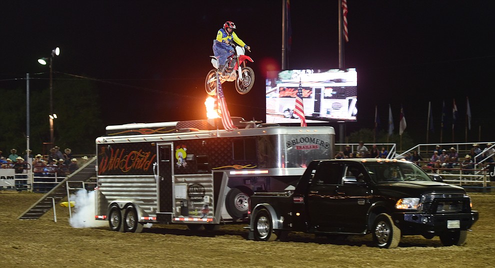 Troy (The Wild Child) Lerwill jumps his trailer during the opening performance of the Prescott Frontier Days Rodeo Wednesday, June 28 at the Prescott Rodeo Grounds.  (Les Stukenberg/Courier)