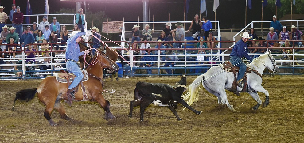 Jake Orman and Tyler Domingue ran a 5.7 second team roping run during the opening performance of the Prescott Frontier Days Rodeo Wednesday, June 28 at the Prescott Rodeo Grounds.  (Les Stukenberg/Courier)