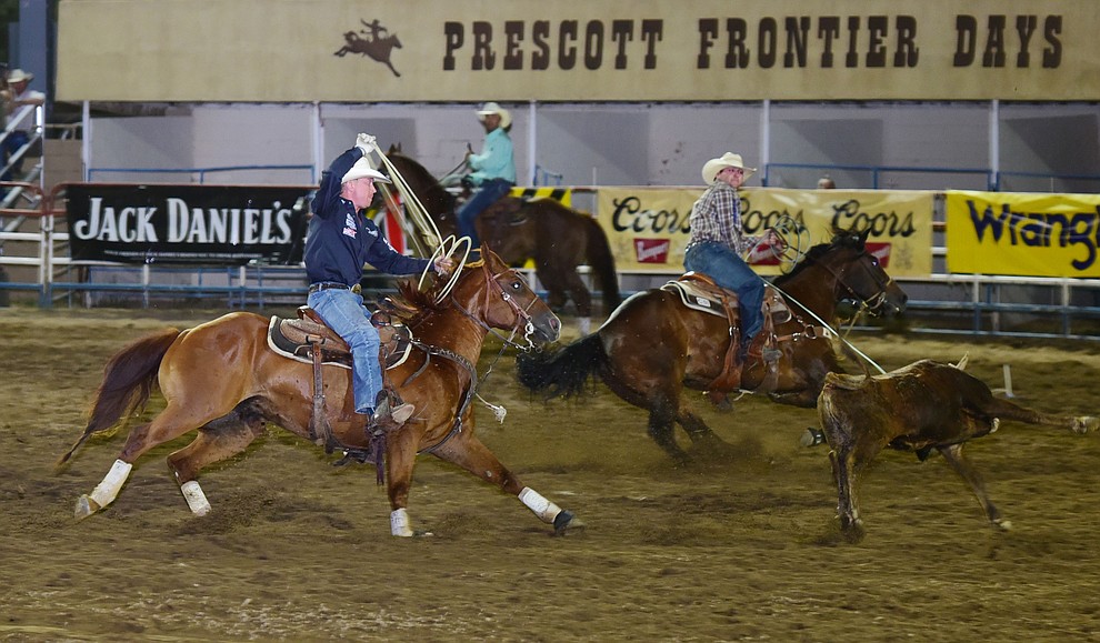 Tyler Wade and Clint Summers had a 6.5 second run in the team roping during the opening performance of the Prescott Frontier Days Rodeo Wednesday, June 28 at the Prescott Rodeo Grounds.  (Les Stukenberg/Courier)