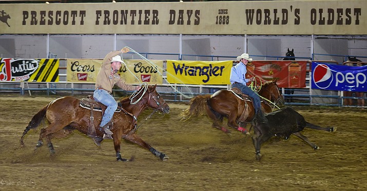 Hayes Smith and Cesar de la Cruz had a 7.3 second run in the team roping during the opening performance of the Prescott Frontier Days Rodeo Wednesday, June 28 at the Prescott Rodeo Grounds.  (Les Stukenberg/Courier)