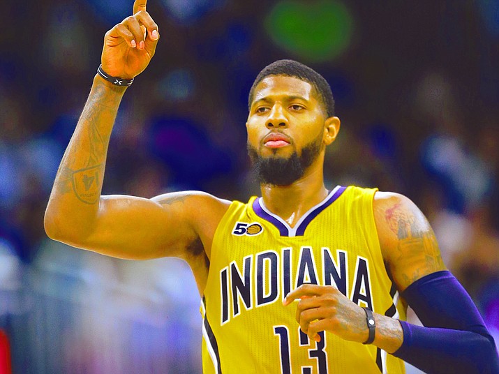 FILE - In this April 8, 2017, file photo, Indiana Pacers' Paul George gestures after making a 3-point basket against the Orlando Magic during an NBA basketball game in Orlando, Fla. George is committed to playing for the Pacers next season. After that, it's anybody's guess. The four-time All-Star forward provided clarity on his short-term plan Thursday before playing in a charity softball game just a short walk away from the only NBA arena he's called home. (John Raoux/AP, File)