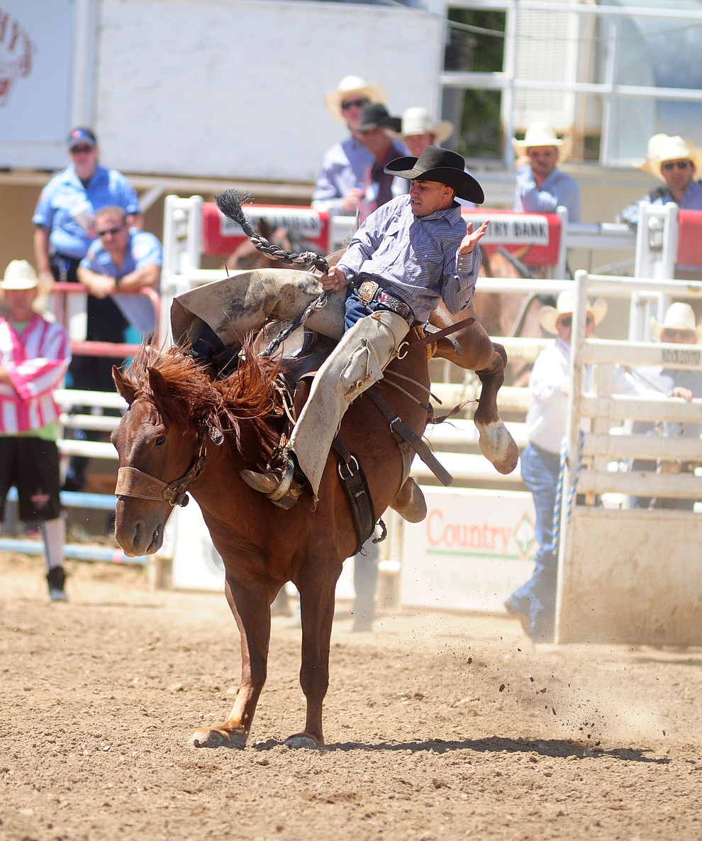 Luke Petrocolli rides in the Cowpuncher's Ranch Bronc Riding during the 4th performance of the 2017 Prescott Frontier Days Rodeo at the Prescott Rodeo Grounds Saturday, July 1.  (Les Stukenberg/Courier)