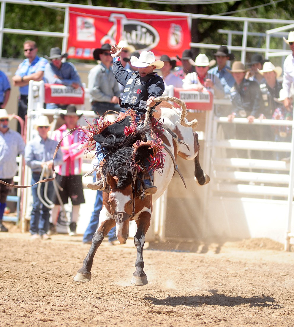 Cody Wright on Painted Bear in the Saddle Bronc during the 4th performance of the 2017 Prescott Frontier Days Rodeo at the Prescott Rodeo Grounds Saturday, July 1.  (Les Stukenberg/Courier)