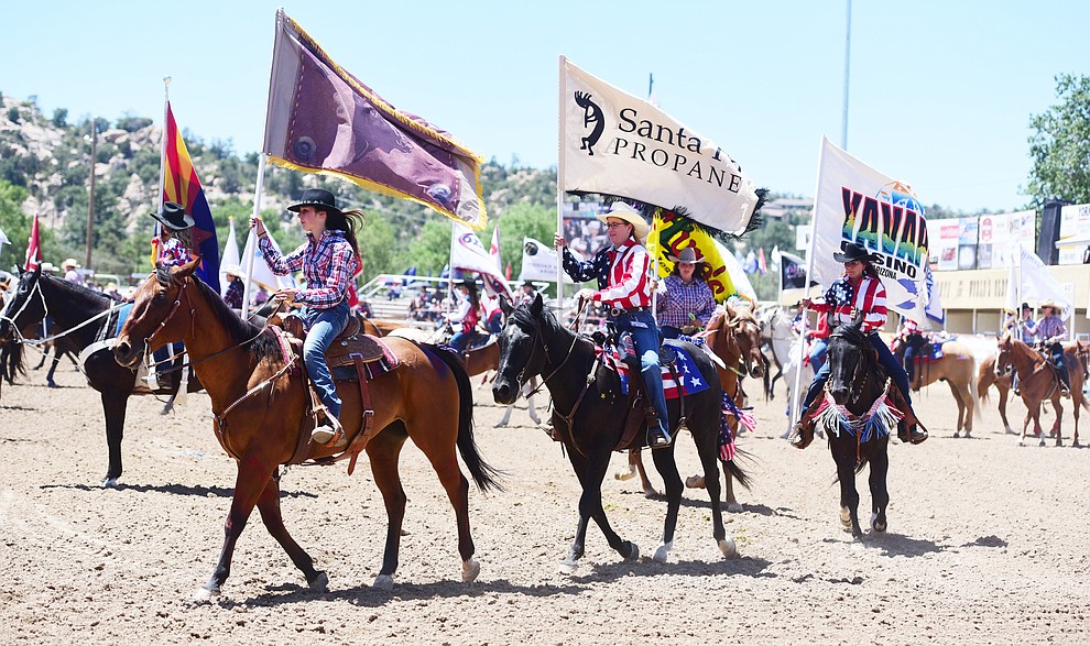 The grand entry during the 8th and final performance of the Prescott Frontier Days Rodeo Tuesday, July 4 at the Prescott Rodeo Grounds.  (Les Stukenberg/Courier)