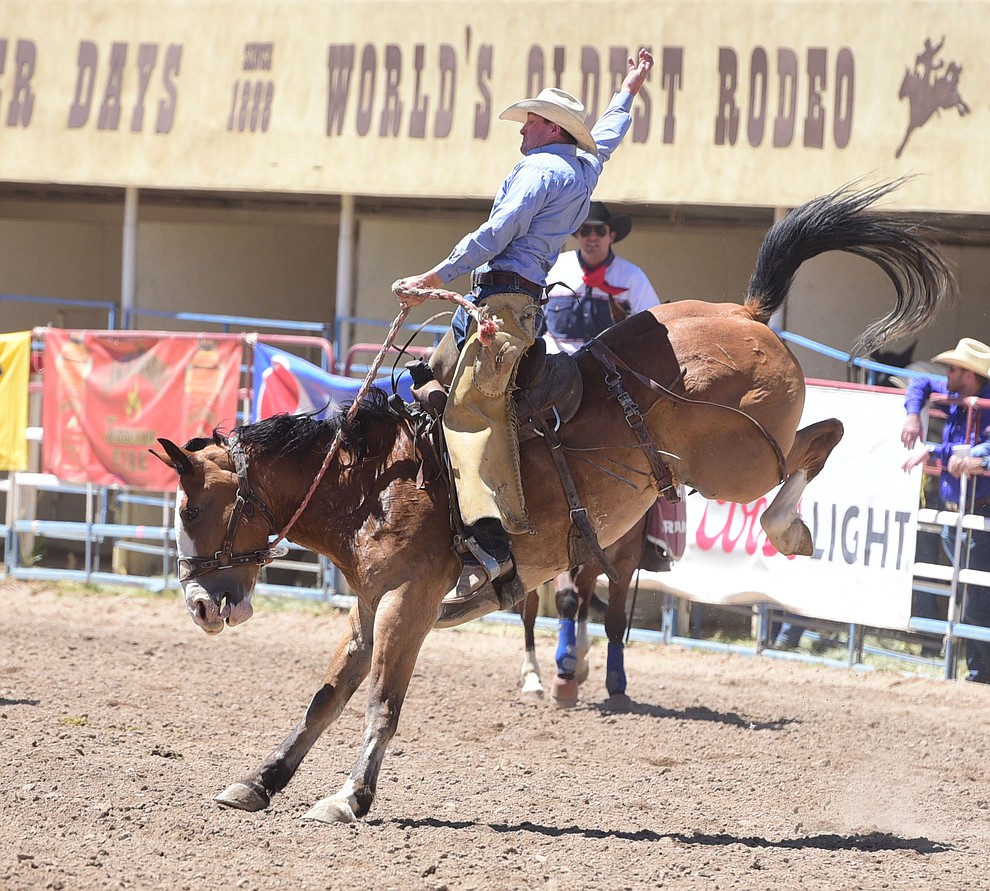 Miles Dewitt wins the Cowpuncher's Ranch Bronc Riding with a score of 86 during the 8th and final performance of the Prescott Frontier Days Rodeo Tuesday, July 4 at the Prescott Rodeo Grounds.  (Les Stukenberg/Courier)