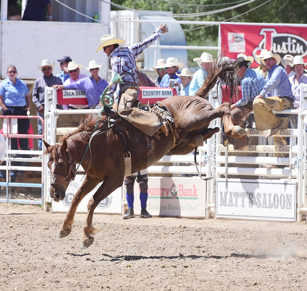 Huckleberry Sandsness rides in the Cowpuncher's Ranch Bronc riding during the 8th and final performance of the Prescott Frontier Days Rodeo Tuesday, July 4 at the Prescott Rodeo Grounds.  (Les Stukenberg/Courier)