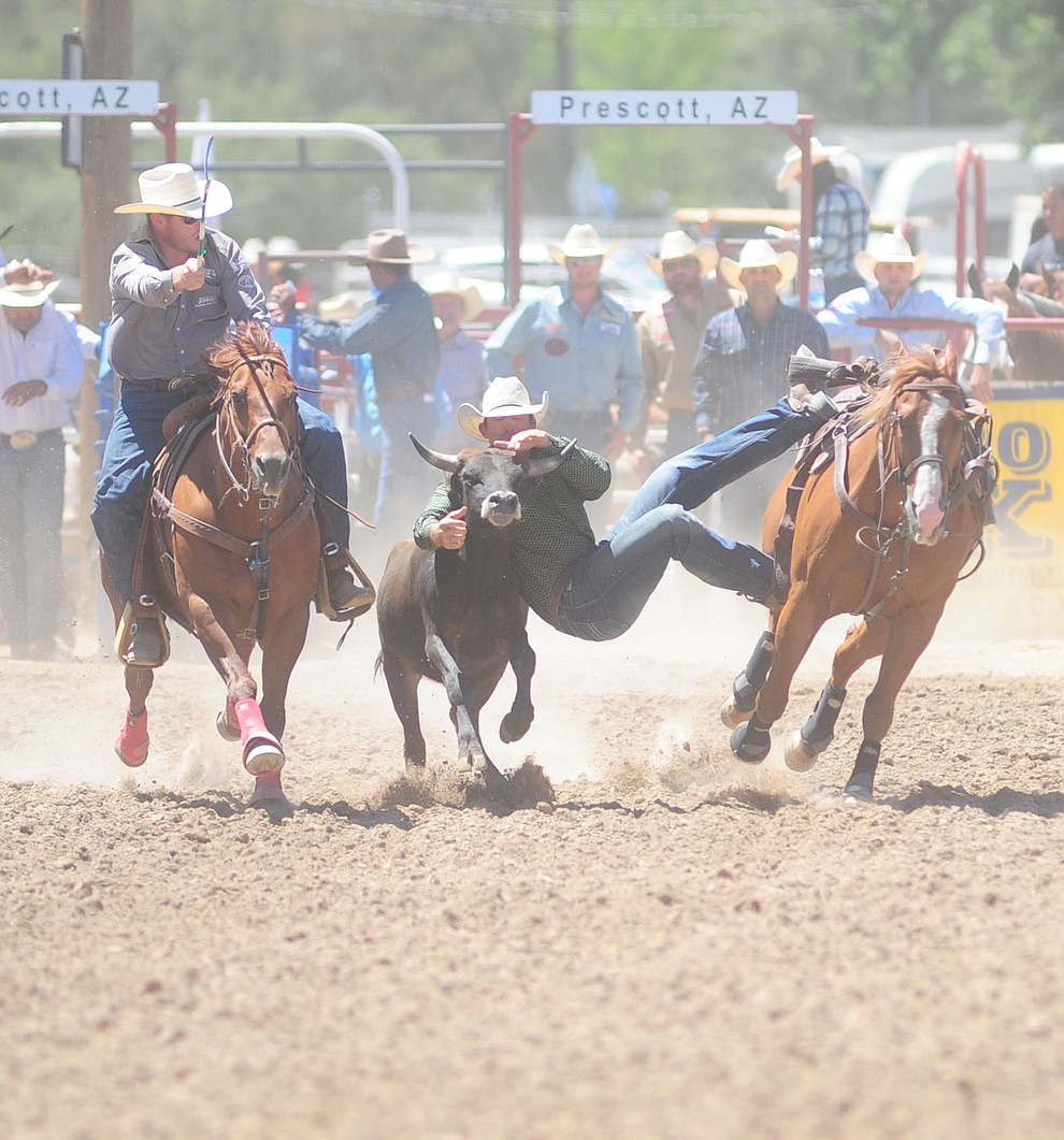 Ryles Smith in the steer wrestling during the 8th and final performance of the Prescott Frontier Days Rodeo Tuesday, July 4 at the Prescott Rodeo Grounds.  (Les Stukenberg/Courier)