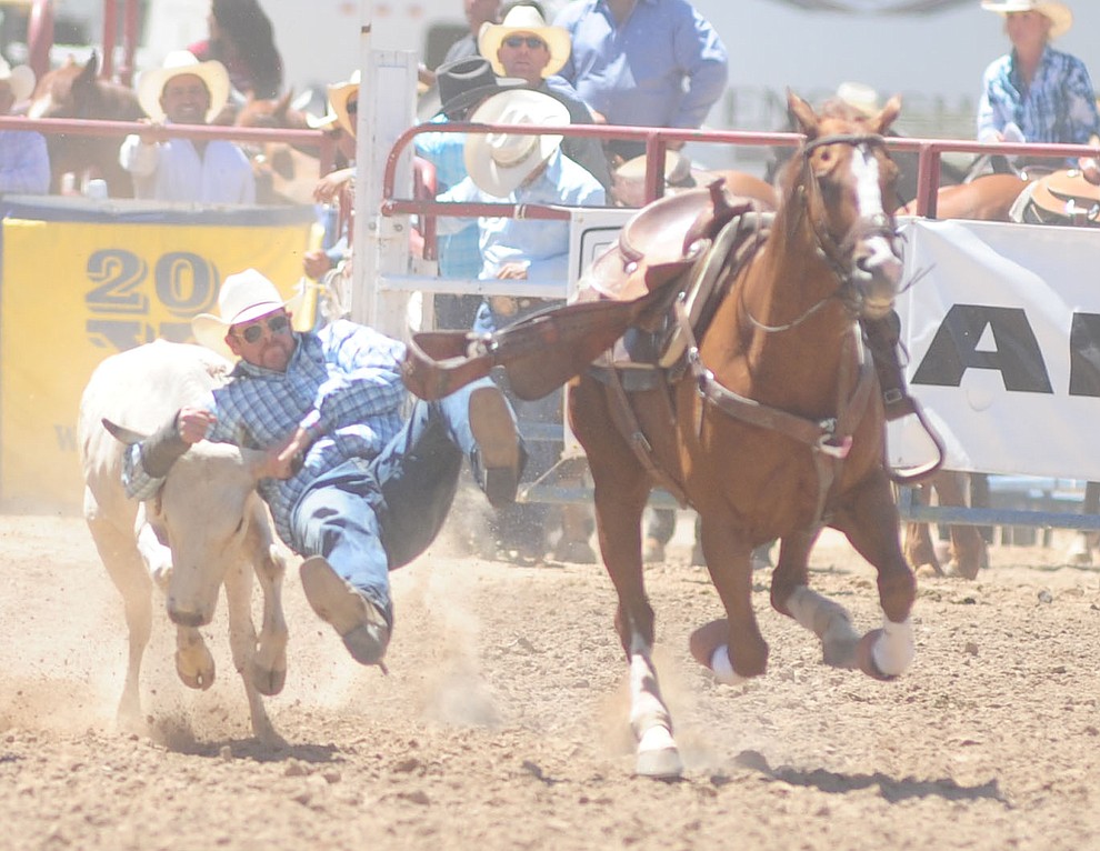 Dean McIntyre had a 4.7 second run in the steer wrestling during the 8th and final performance of the Prescott Frontier Days Rodeo Tuesday, July 4 at the Prescott Rodeo Grounds.  (Les Stukenberg/Courier)