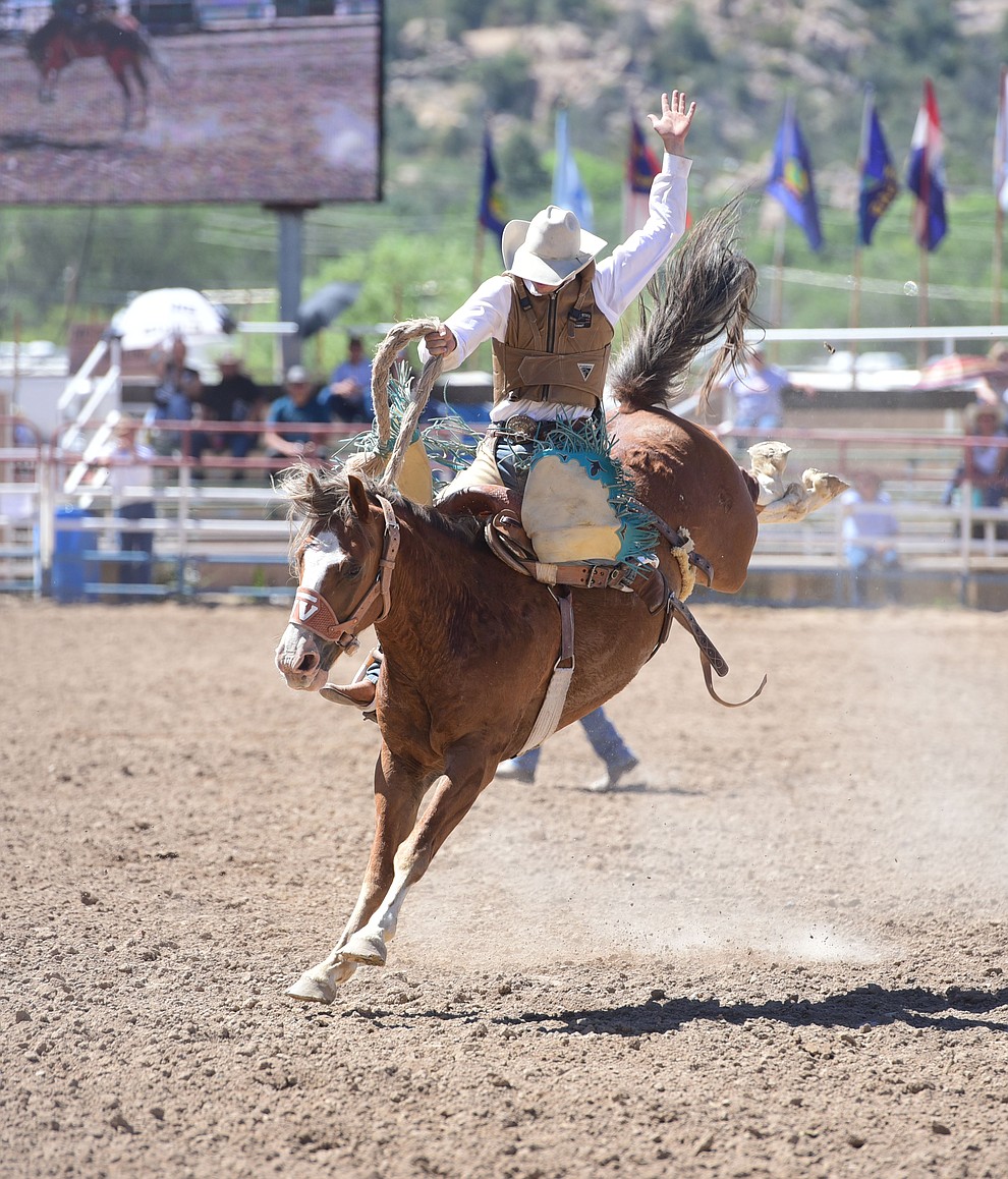 Quincy Crum rides Double Trouble in the saddle bronc during the 8th and final performance of the Prescott Frontier Days Rodeo Tuesday, July 4 at the Prescott Rodeo Grounds.  (Les Stukenberg/Courier)
