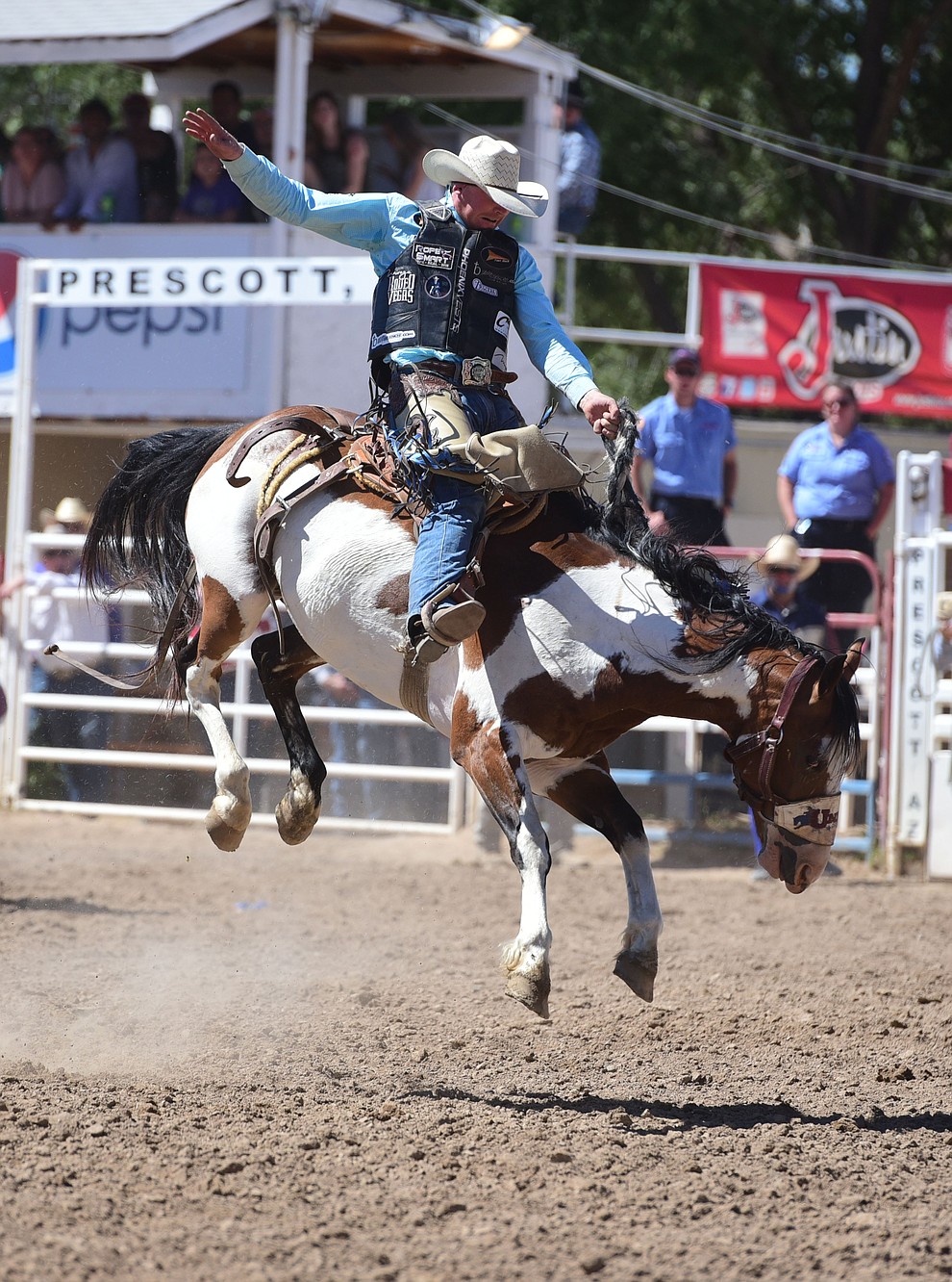 Taos Muncy rides War Wagon in the saddle bronc during the 8th and final performance of the Prescott Frontier Days Rodeo Tuesday, July 4 at the Prescott Rodeo Grounds.  (Les Stukenberg/Courier)