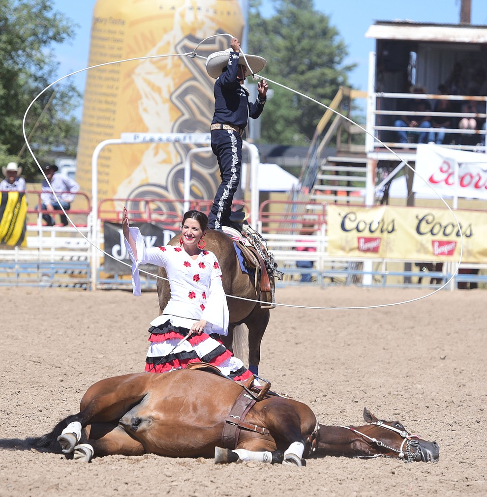 Tomas Garcilazo and his wife Justine perform during the 8th and final performance of the Prescott Frontier Days Rodeo Tuesday, July 4 at the Prescott Rodeo Grounds.  (Les Stukenberg/Courier)