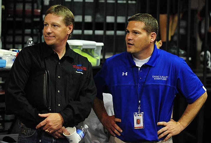Camp Verde Wrestling Head Coach Bob Weir and Chino Valley Coach Allen Foster, right, watch some of the action before the second round of the Arizona Interscholastic Association State Wrestling Tournament in 2014. (Les Stukenberg/Courier file)