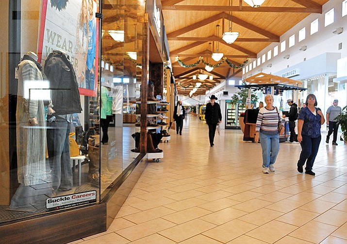 Prescott Gateway Mall patrons walk down the main hall while shopping in Prescott.