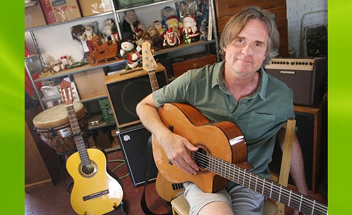 Earlier this year, Camp Verde resident Rick Flom closed his upscale resale shop, Rick’s Picks. Now, Flom, a lifelong musician, teaches guitar. (Photo by Bill Helm) 
