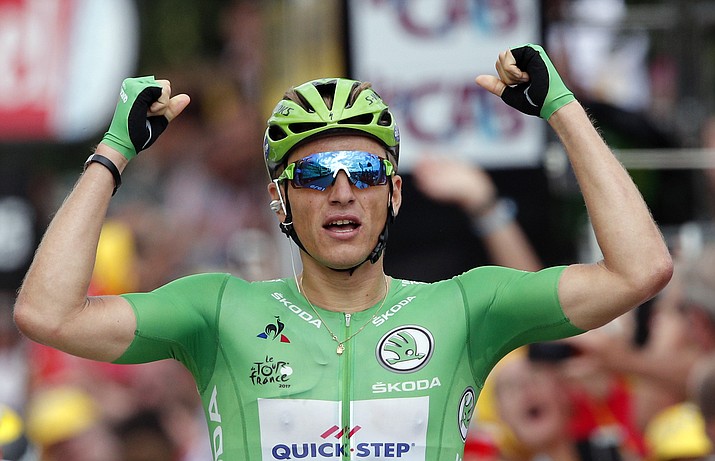 Germany’s Marcel Kittel, wearing the best sprinter’s green jersey celebrates as he crosses the finish line to win the tenth stage of the Tour de France cycling race over 110.6 miles with start in Perigueux and finish in Bergerac, France, on Tuesday, July 11, 2017. (Christophe Ena/AP)