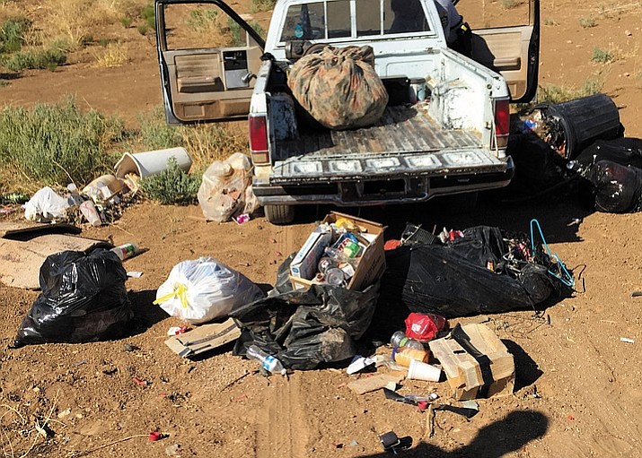 The Mohave County Environmental Rural Area Cleanup Enforcement detectives received a phone call from a witness about a man dumping trash in the desert near Kingman Wednesday. An investigation led to an area where they watched Christopher McKinney, 35, allegedly unload trash debris from a truck bed while parked in a gully.
 (Photo courtesy of ERACE)