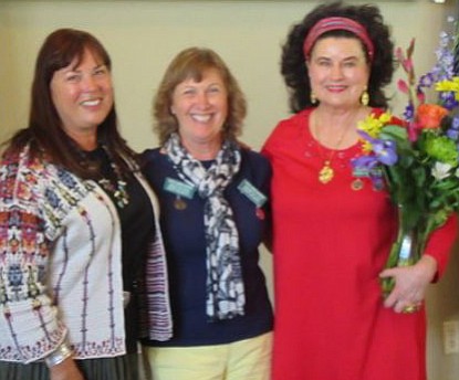 New co-presidents of Prescott Art Docents present a bouquet to the outgoing president.