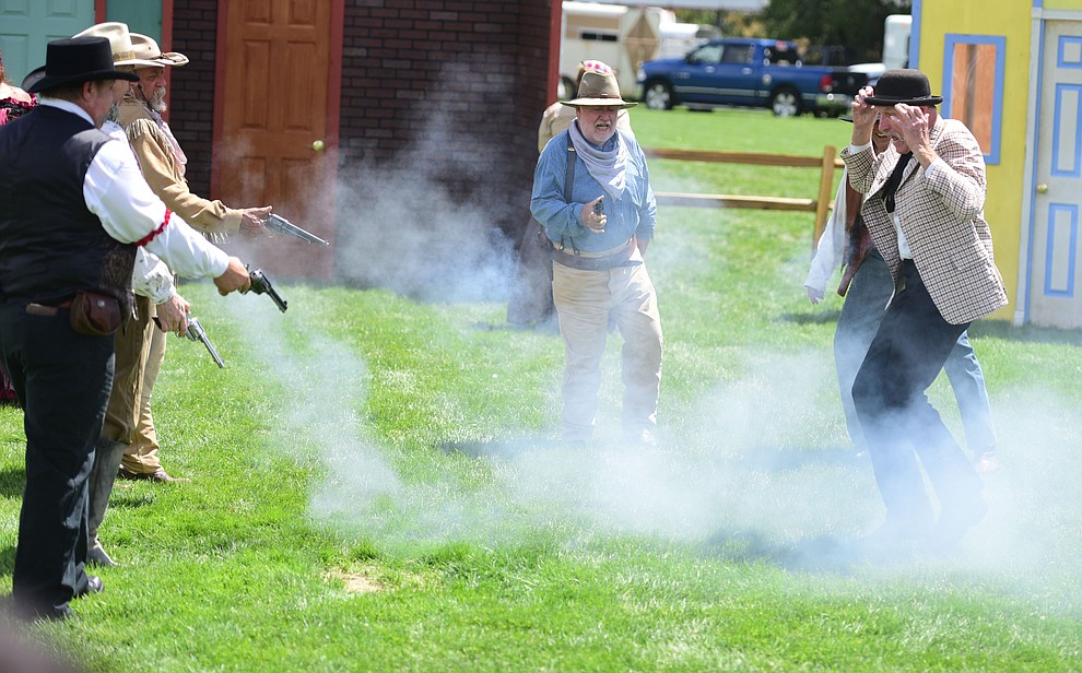 The Arizona Gunfighters reenact several scenes from the old west in the 12th annual Shootout on Whiskey Row Saturday, July 22 in downtown Prescott. The event continues Sunday and is free with food and gift vendors on the Prescott Mile High Middle School football field. (Les Stukenberg/Courier)