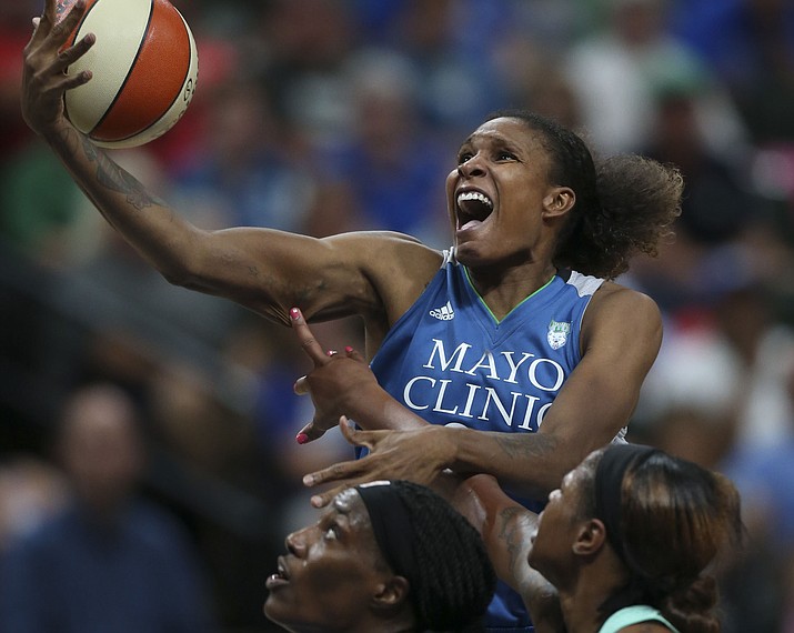 Minnesota Lynx forward Rebekkah Brunson (32) was stripped of the ball while driving for a shot by New York Liberty center Kia Vaughn (7) in the second half in St. Paul, Minn., Tuesday, July 25, 2017. (Jeff Wheeler/Star Tribune via AP)