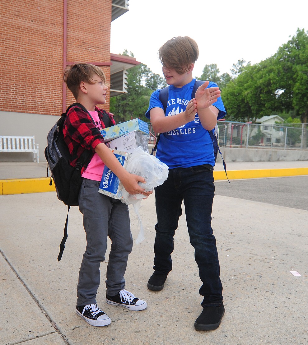 Jamis Evensen tells his brother Jaxon where to go at Lincoln School as students began the 2017-18 school year Thursday, August 2 in Prescott. (Les Stukenberg/Courier)