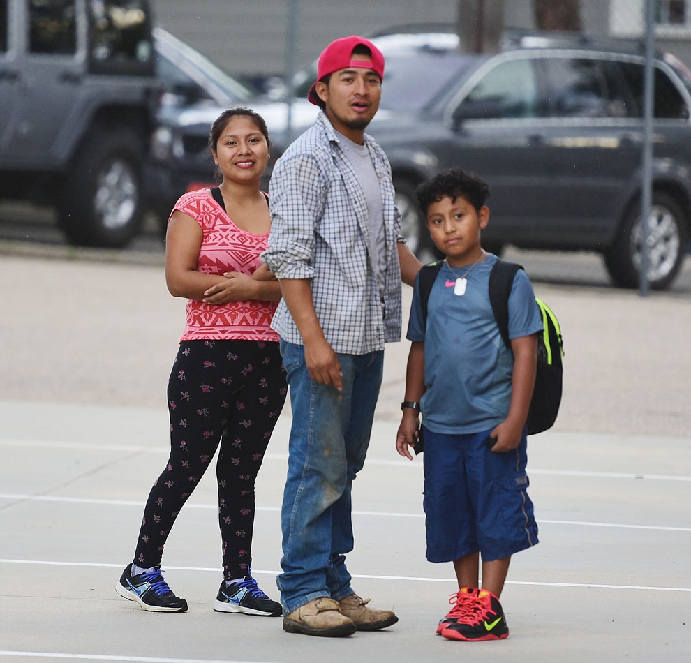 Jhonatan Cahuec Manuel arrives with his parents Elizabeth and Marvin at Lincoln School as students began the 2017-18 school year Thursday, August 2 in Prescott. (Les Stukenberg/Courier)