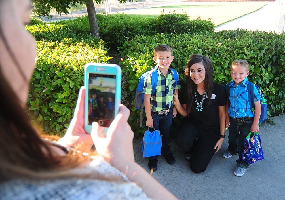 The Scarborough family gets their photo taken at Territorial Elementary School in Chino Valley Tuesday, August 8. (Les Stukenberg/The Daily Courier).